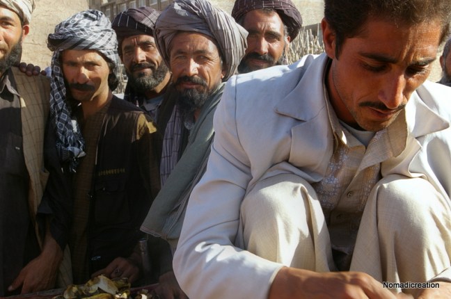 At any market in Afghanistan I was a curiosity. Check the man on the cart his shirt! Nov. 2007