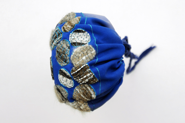 Entirely decorated with animal hairs found on dead road kill examples through South America