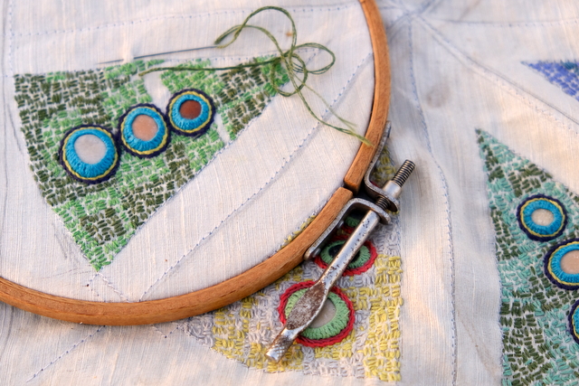 Stitching flat and small stones on to silk cotton